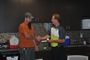 Mark congratulating Robbie on 5 years at All-Color.