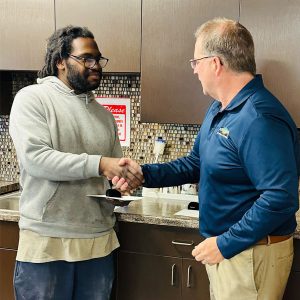 aaron-mark-handshake-web